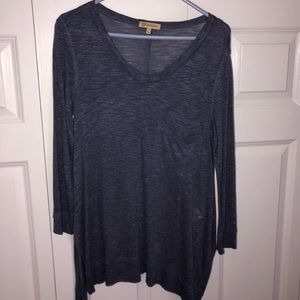 Three quarter length blue shirt